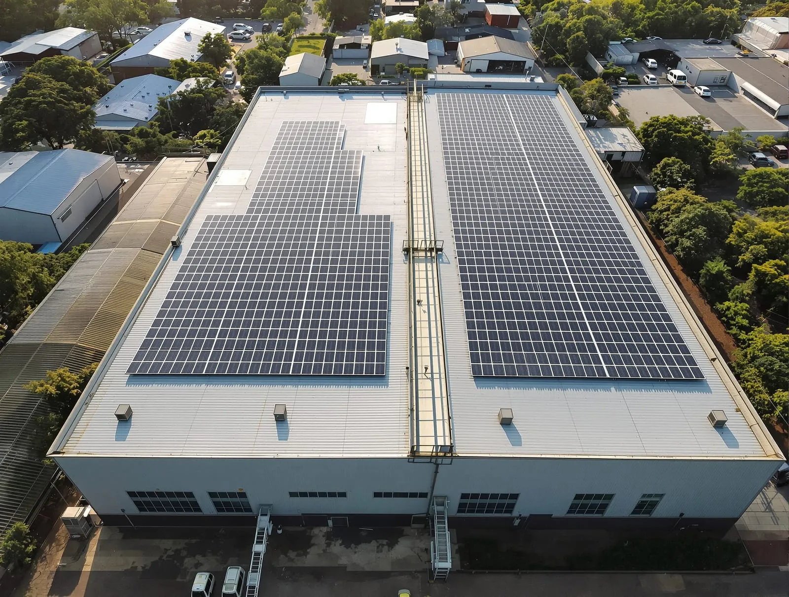 Illustrative image: solar panels covering a factory roof